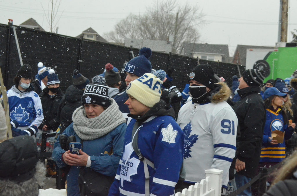 Toronto Maple Leafs players line up for the Canadian national anthem before  playing against the Buffalo Sabres in the NHL Heritage Classic hockey game  in Hamilton, Ontario, on Sunday, March 13, 2022. (